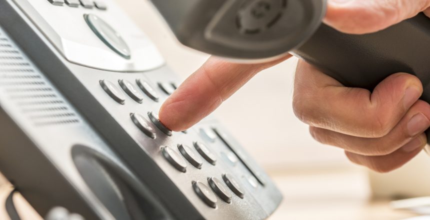 using a landline phone to call leads.
